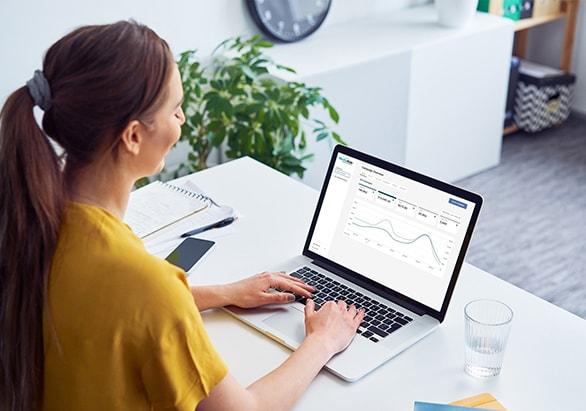 A woman views the MediaAisle dashboard to check her campaign performance.